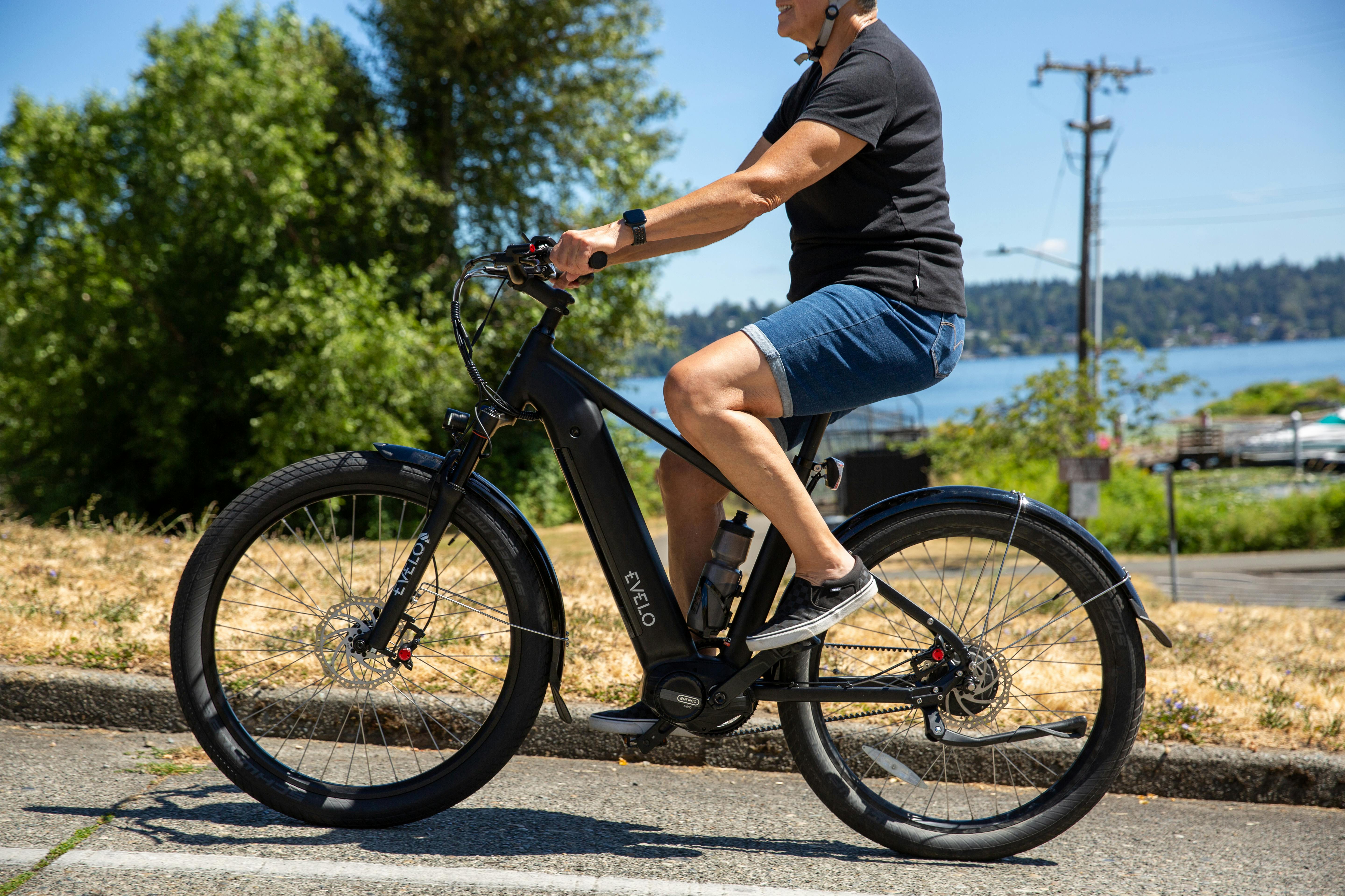 Man in Black Shirt Riding an Electric Bike · Free Stock Photo