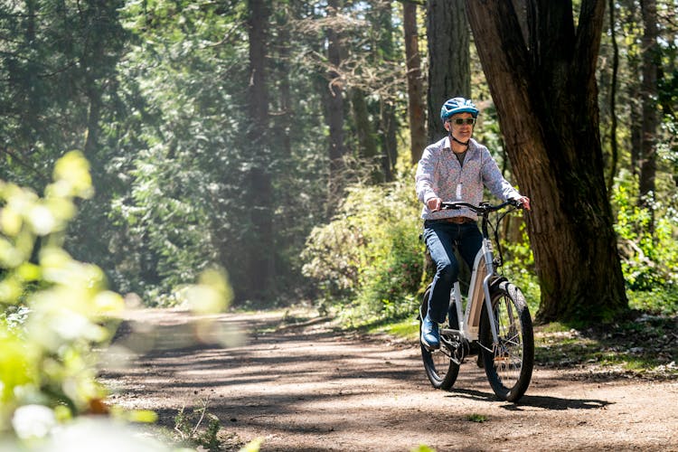 Man Riding Bicycle In The Forest