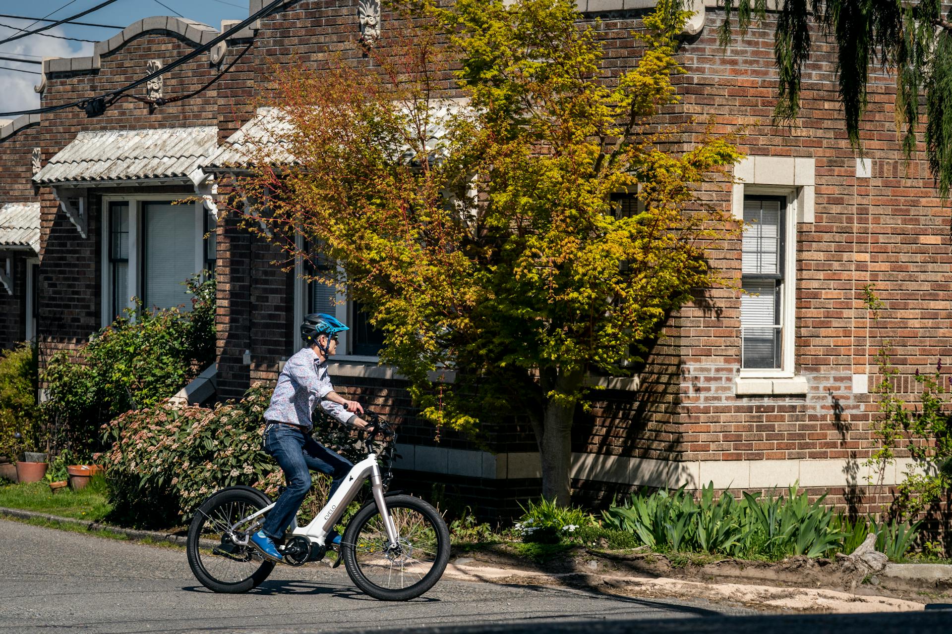 A person riding an electric bike on the street