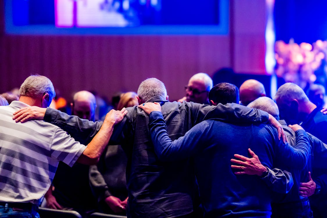 people praying together in church