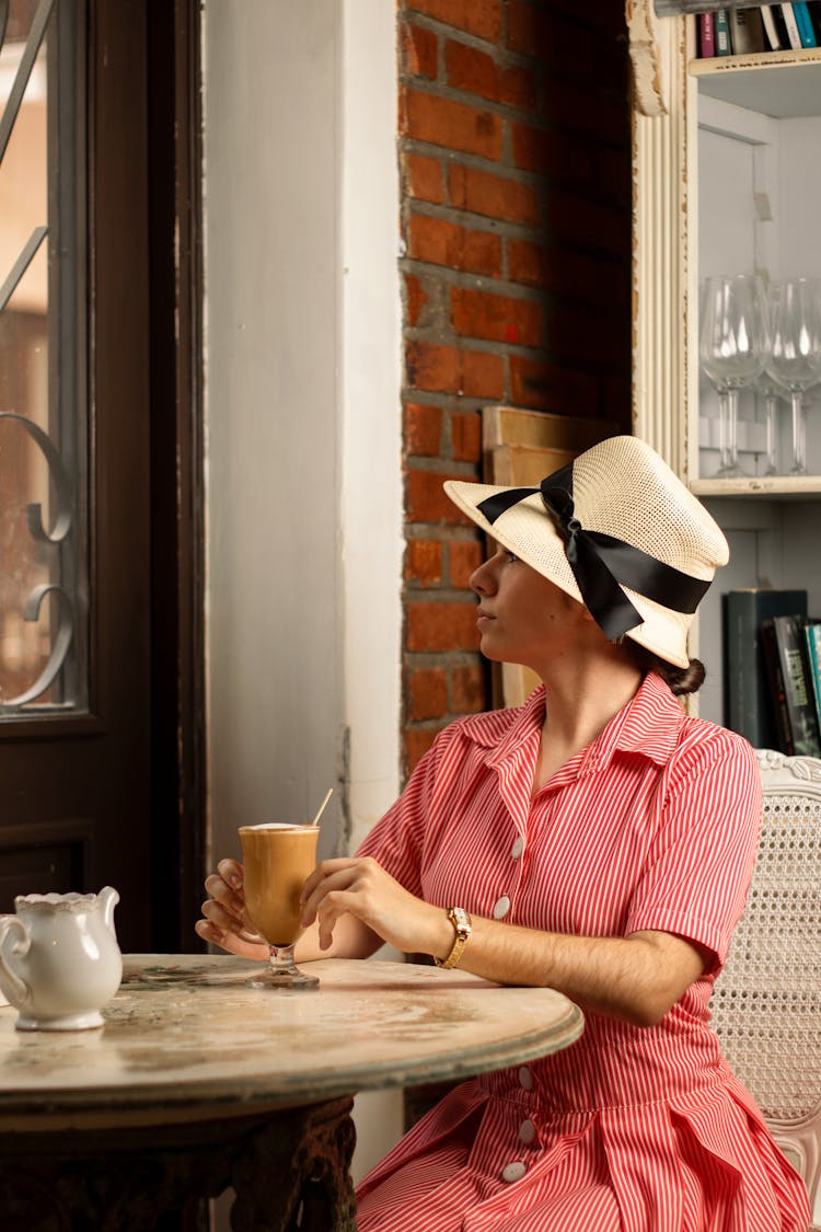 A Woman Having A Glass Of Cold Drink