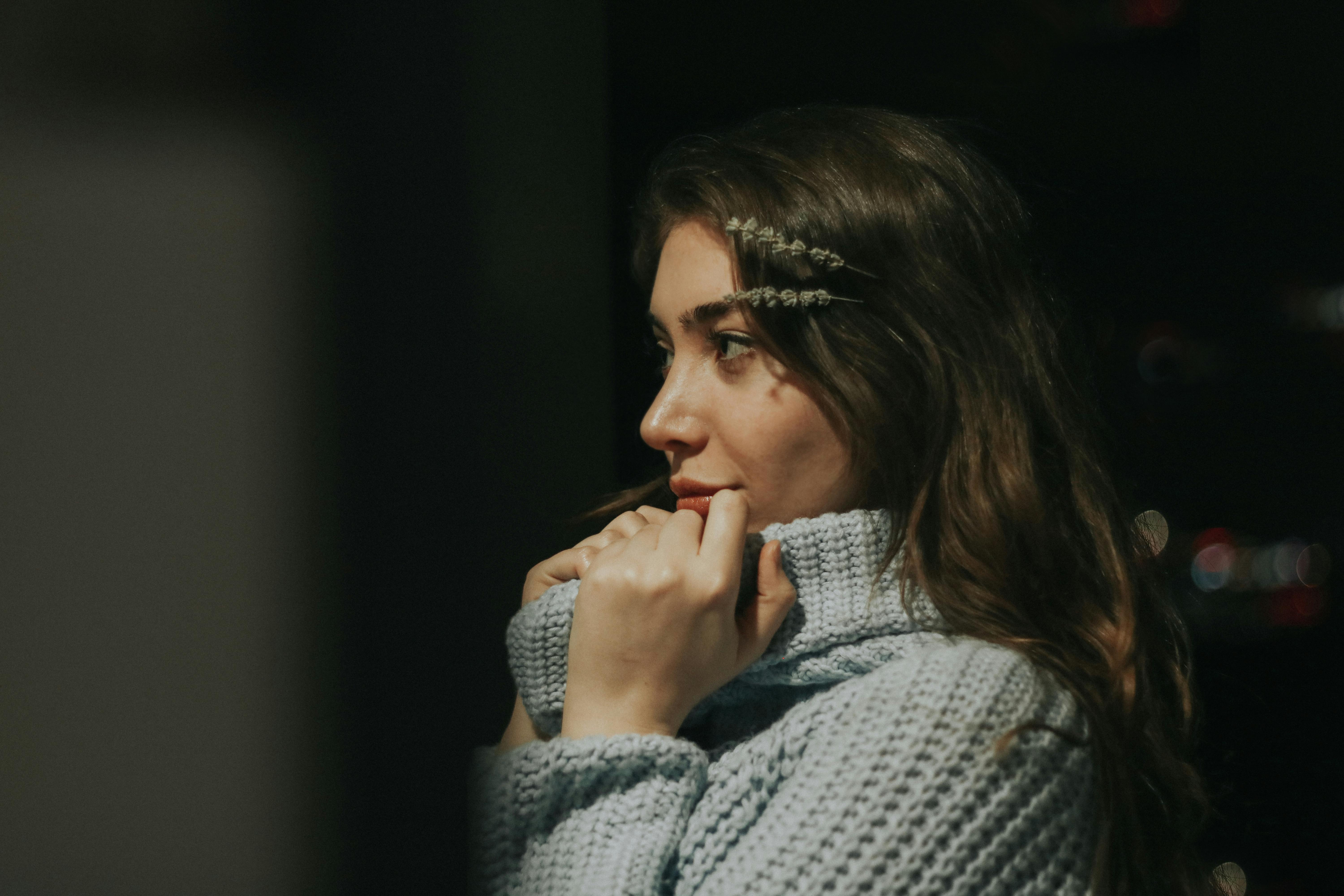 brunette woman wearing blue knitted sweater