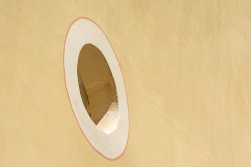 Beige Concrete Wall with Round Window 