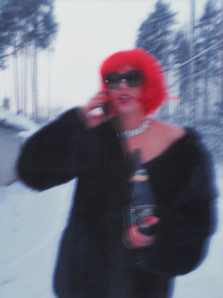 Woman Talking On The Phone In Winter