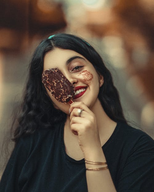 Smiling Brunette Woman with Chocolate Ice Cream