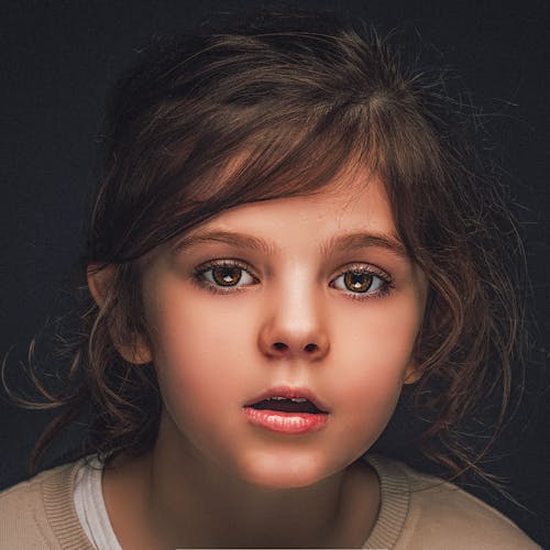 Free Portrait of a Girl with Brown Eyes Stock Photo