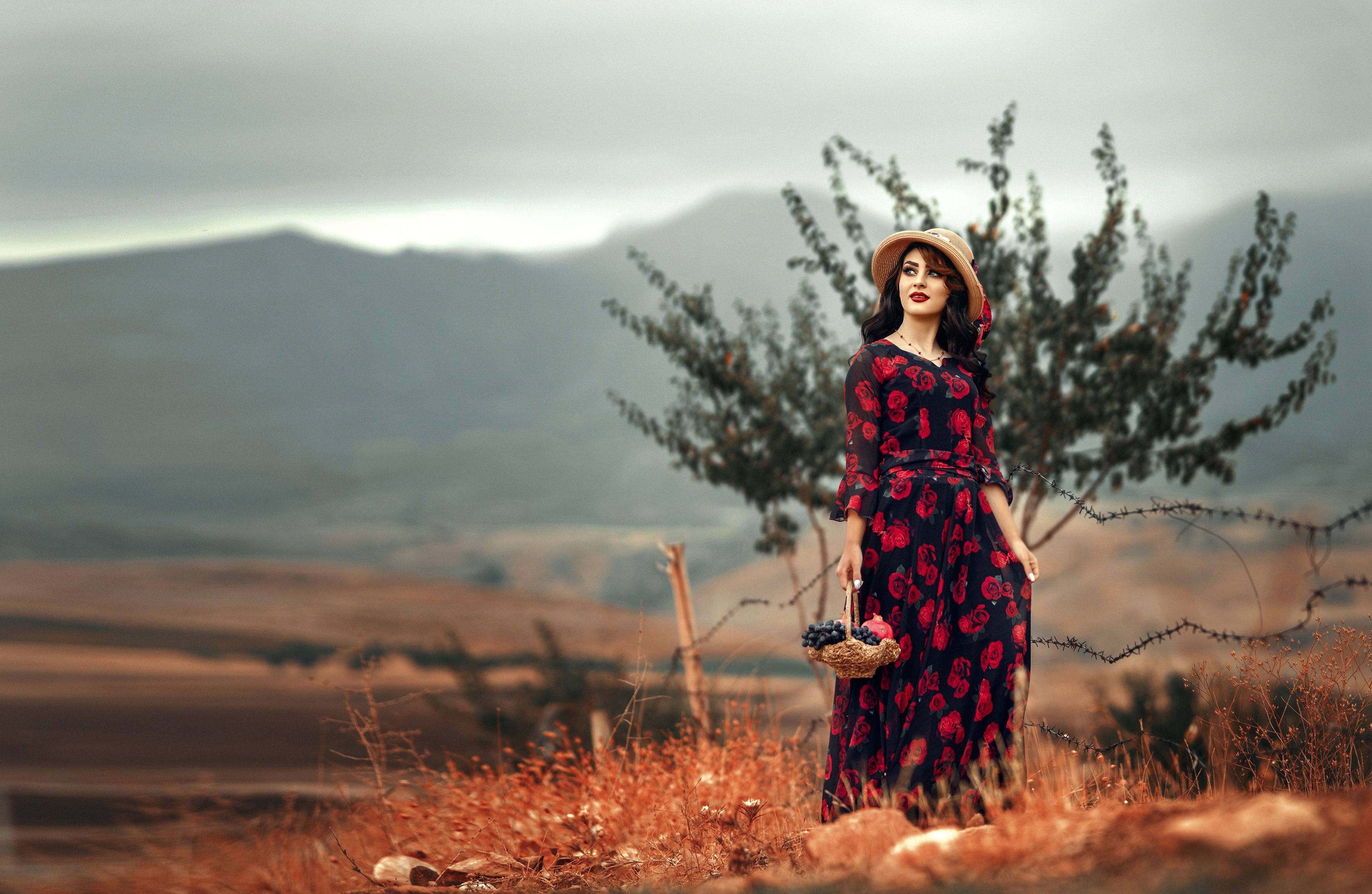 A Woman in Red Floral Dress Holding a Basket · Free Stock Photo