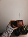 A Person Holding a Radio