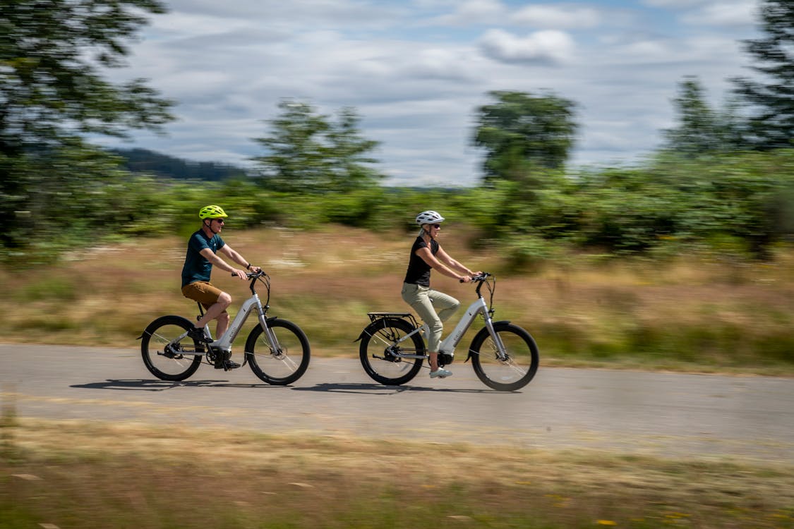 elderly couple riding electric bikes for weight loss