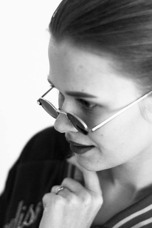 Grayscale Photo of Woman Wearing Sunglasses 
