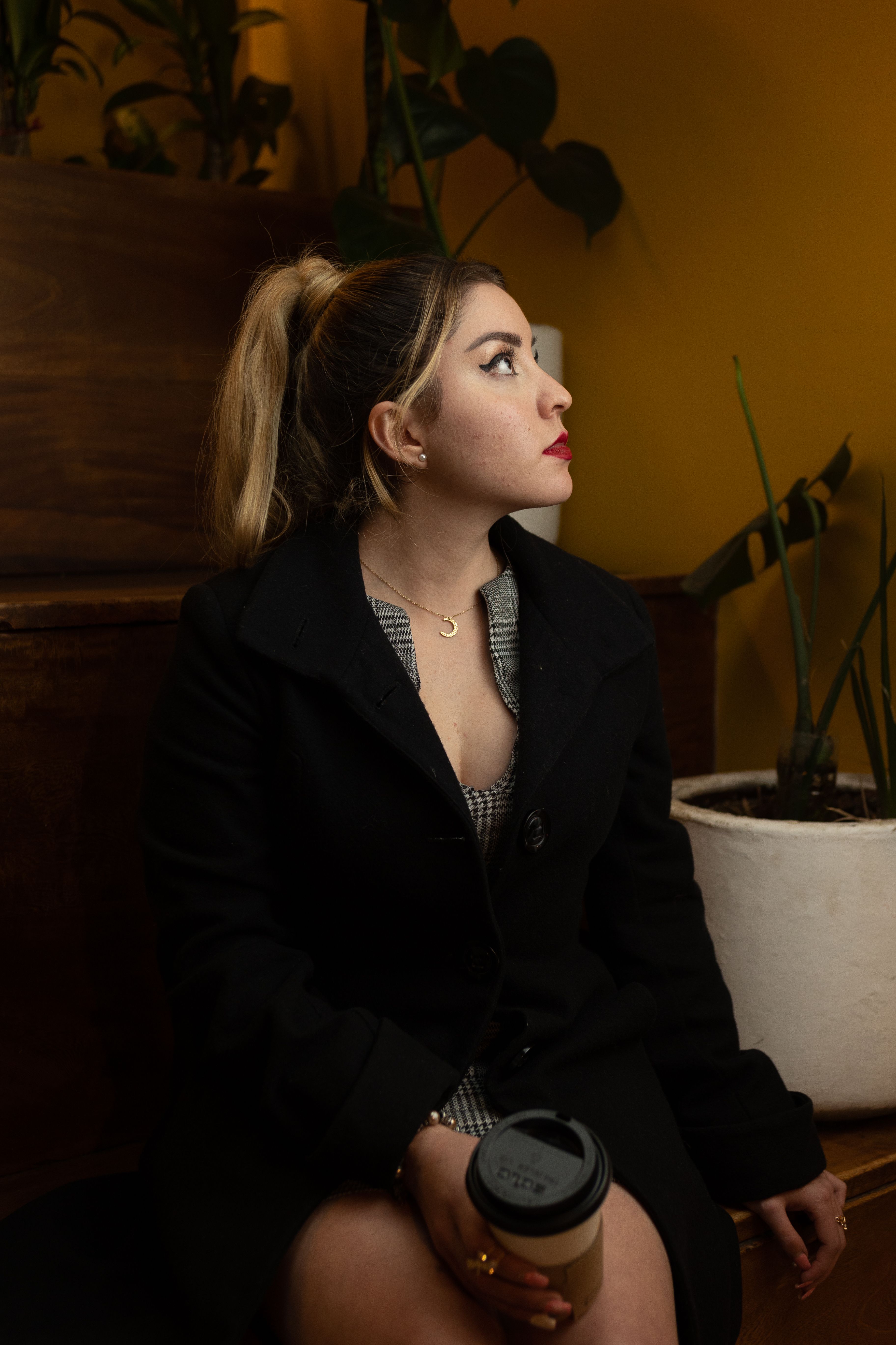 Woman in Black Blazer Holding a Coffee Drink · Free Stock Photo