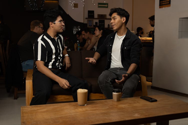 Men Talking Inside A Coffee Shop