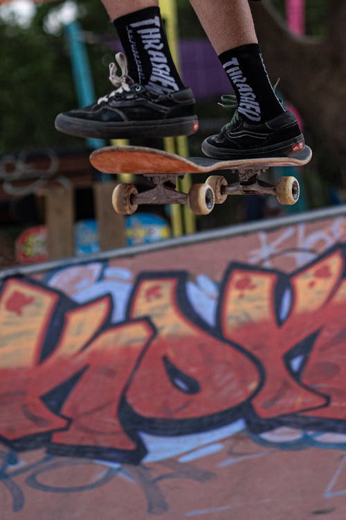 A Skateboarder Performing Jump Tricks