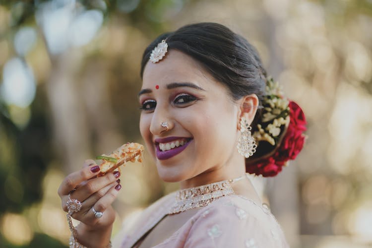 Bride Holding Snack In Hand