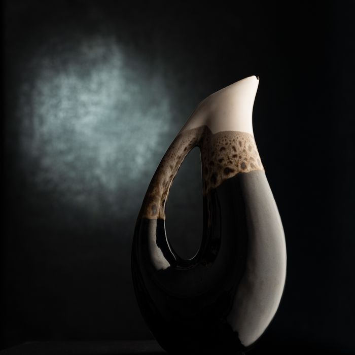 Sculptural vase on a dark ground — Vural Yavas on Pexels