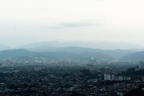 Aerial View of City Buildings on a Foggy Day