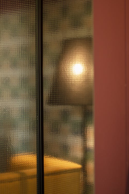 Lamp in Room behind Window