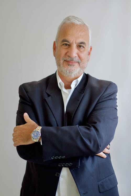 Man in Black Suit Jacket with His Arms Crossed