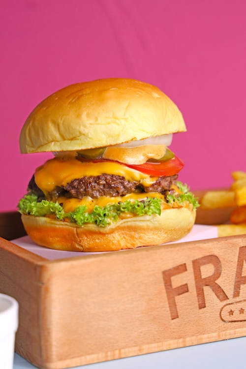 Free A burger with fries and a drink on a tray Stock Photo