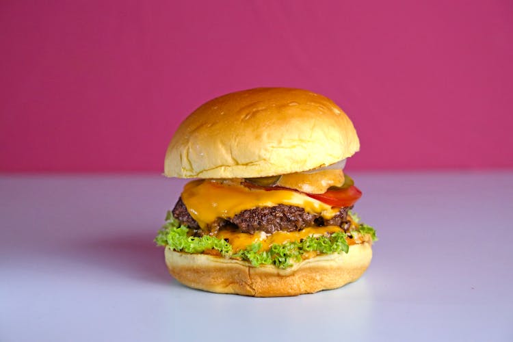 Close-Up Shot Of A Delicious Hamburger On White Surface