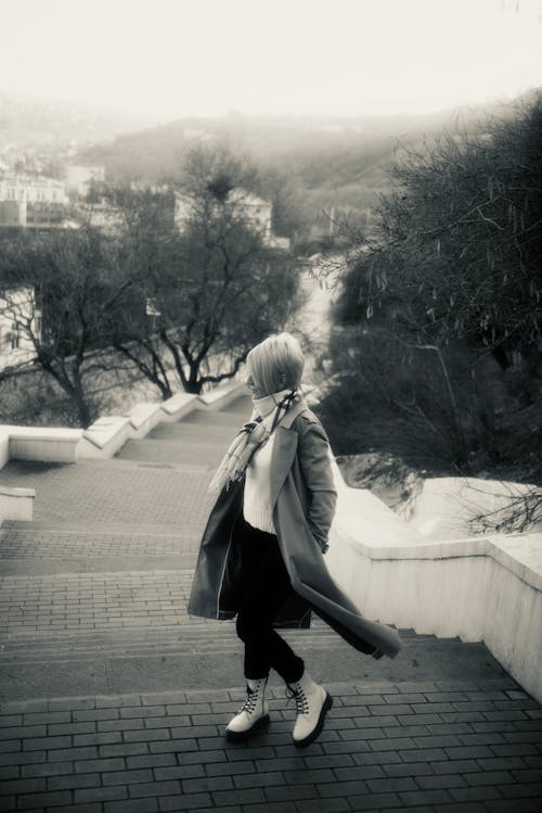 A Woman Climbing Up the Stairs