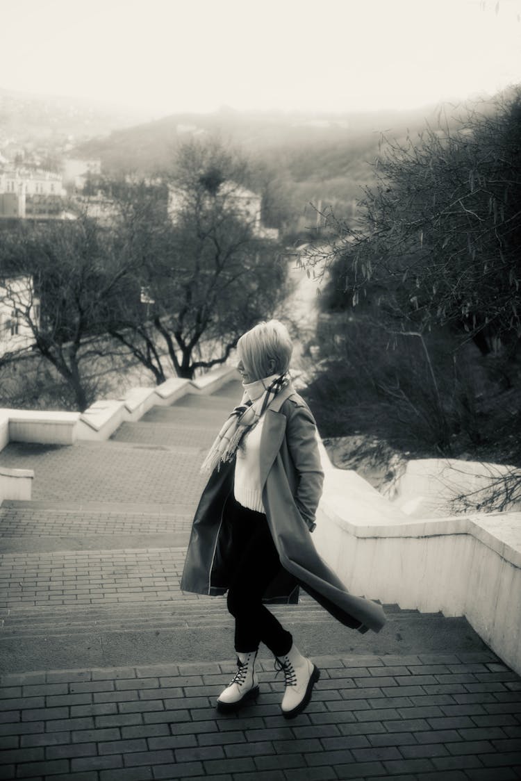 A Woman Climbing Up The Stairs