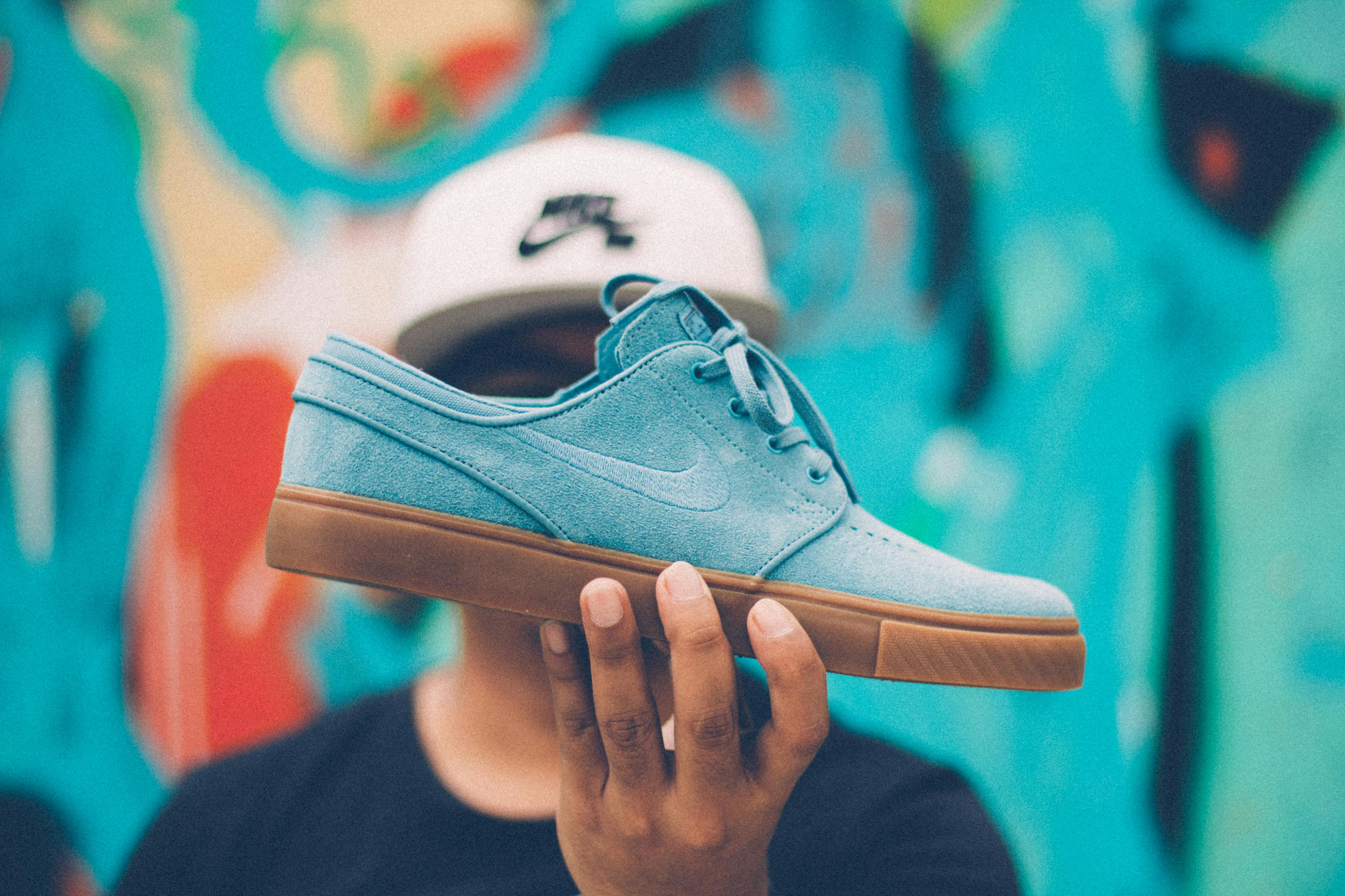 Person Holding Nike Sb Suede Low-top Sneaker \u00b7 Free Stock Photo