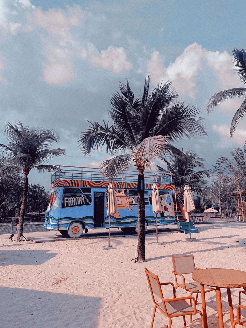 Tour bus parked at an exotic beach