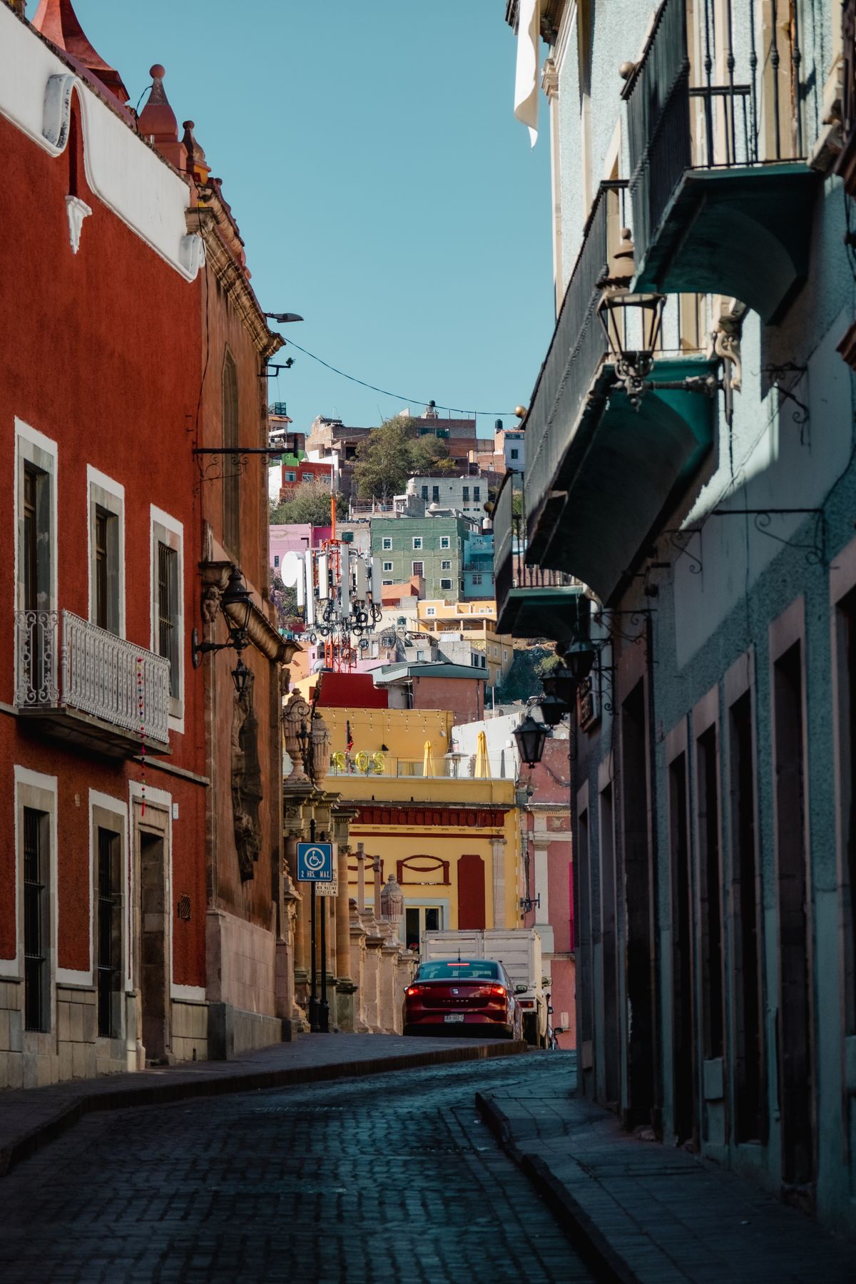 A very narrow alley between two apartment buildings