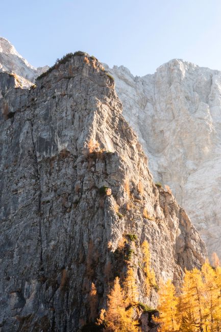 Stunning rock formation illuminated by sunlight in the Soča Valley, Slovenia, during autumn.