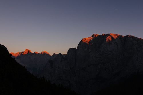 Free Stunning silhouette of the Soča mountains at sunset with a clear sky in Slovenia. Stock Photo