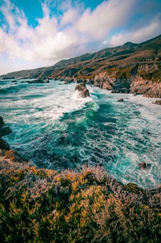 Stunning view of rugged coastline and turquoise waters in Carmel-by-the-Sea, California.