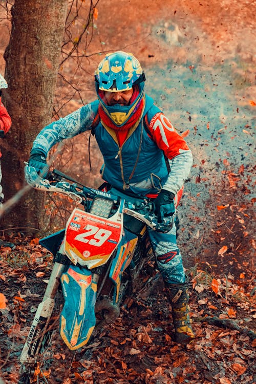 Man Riding His dirt Bike in the Woods