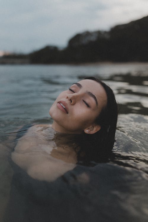 Woman with Eyes Closed in Sea