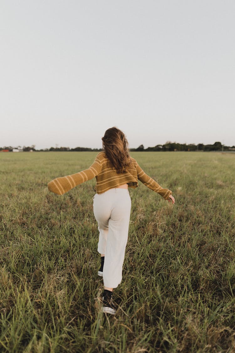 Woman Running In Field