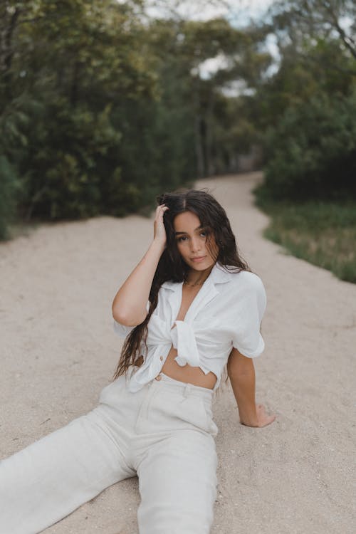 Brunette Posing in White Pants