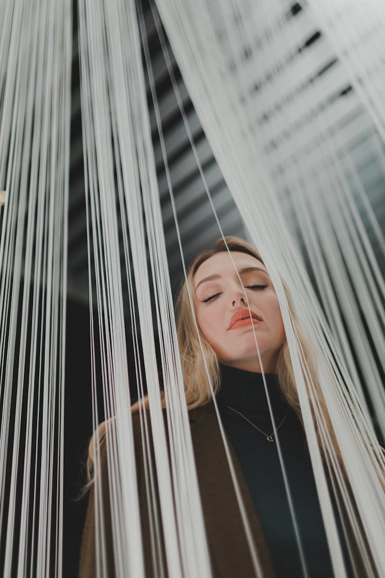 Woman Amidst White Strings 