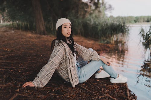 Girl Sitting by a Lake 