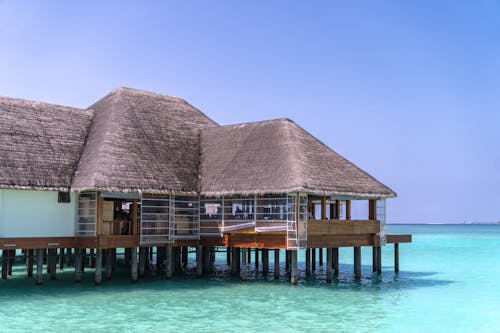 Cottage on Pier on Tropical Sea Shore