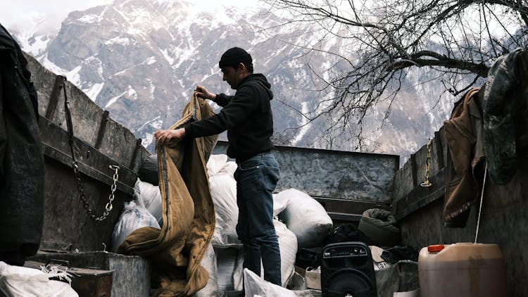 Man Loading Truck In Winter