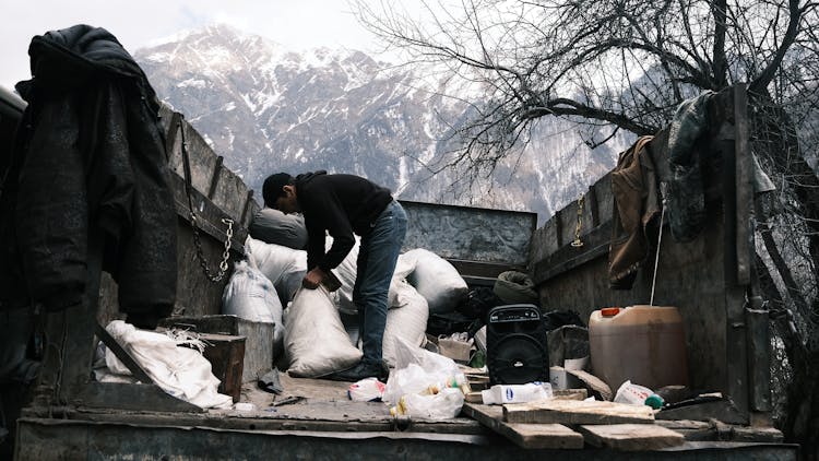 Man Loading Truck In Winter