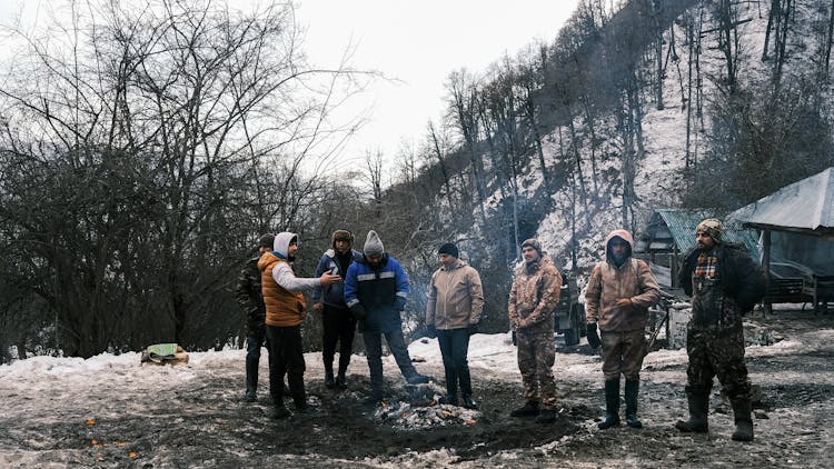 Hunters Gathering In Winter Forest