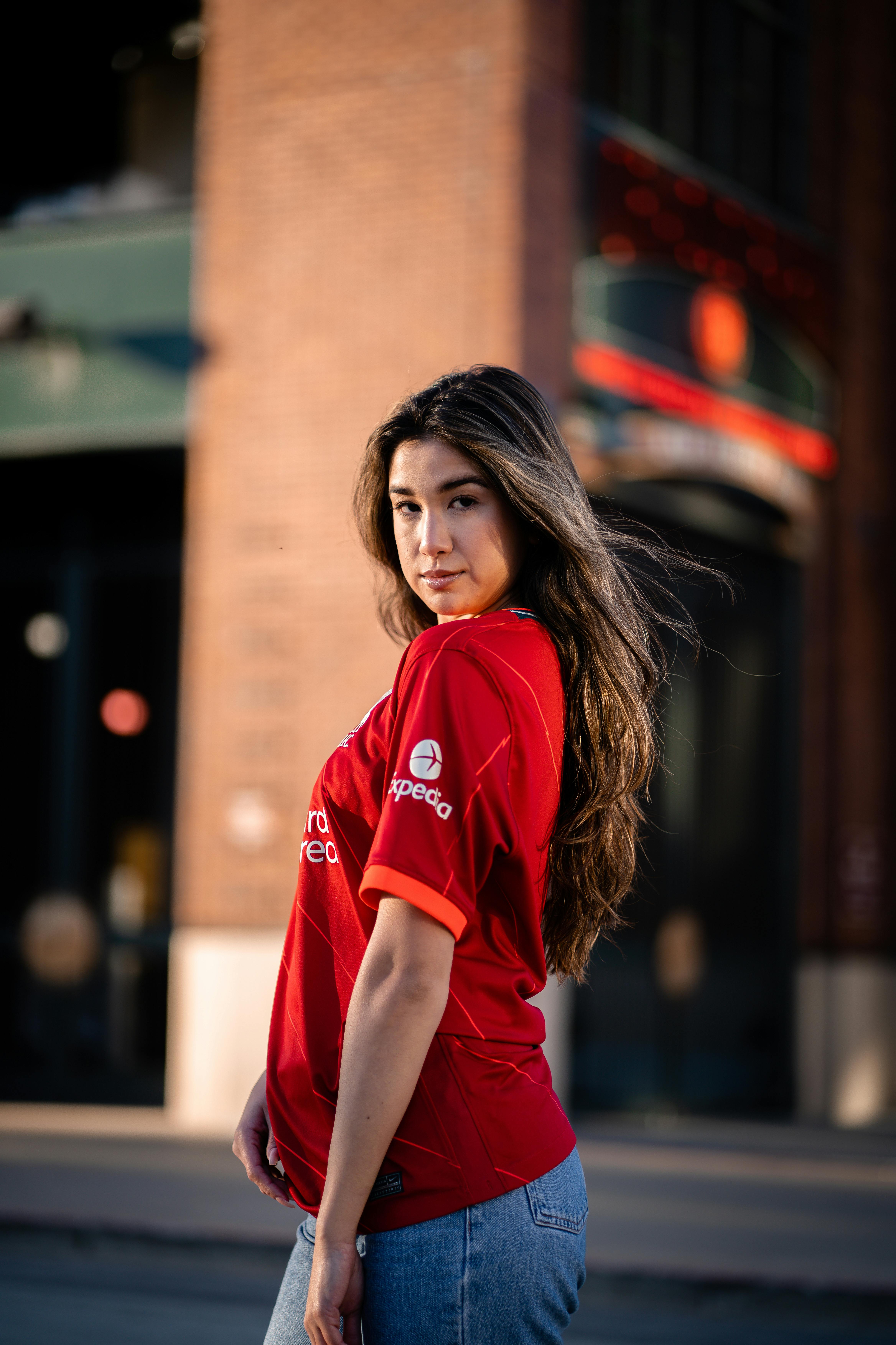 Young Woman in a Football Liverpool FC T-shirt · Free Stock Photo