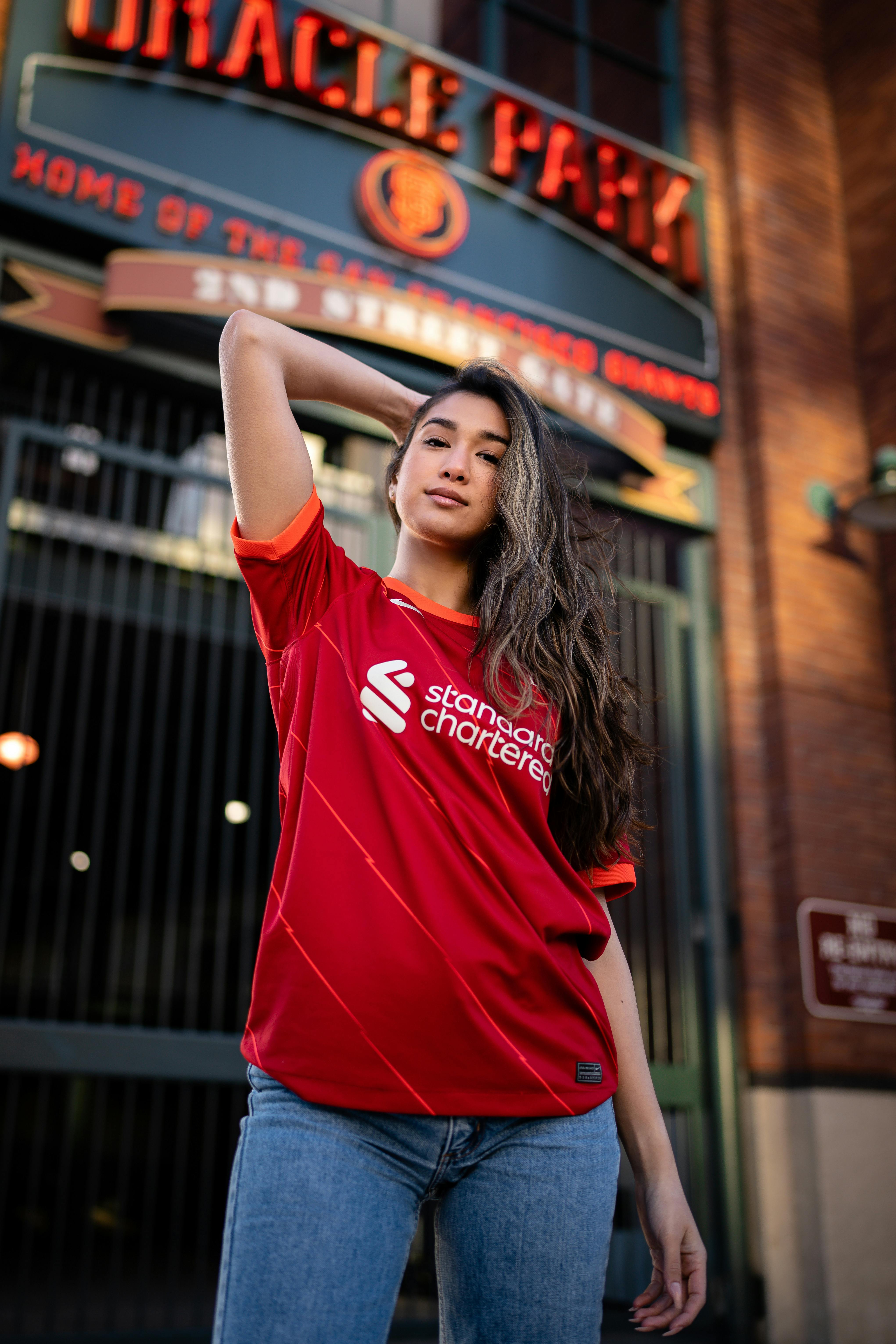 Young Woman in a Football Liverpool FC T-shirt · Free Stock Photo