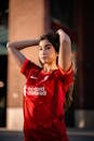 Young Woman in a Football Liverpool FC T-shirt · Free Stock Photo