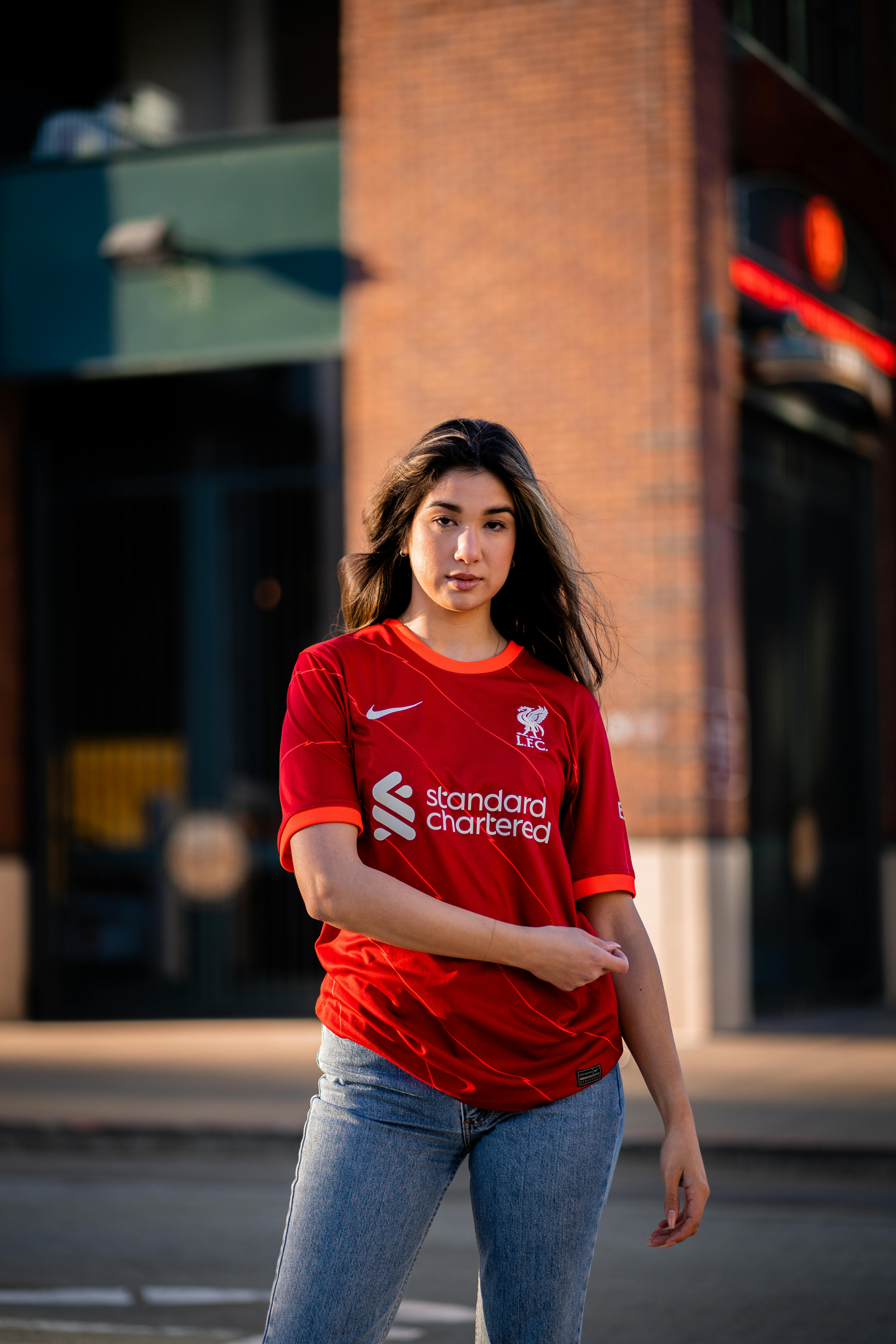 Young Woman in a Football Liverpool FC T-shirt · Free Stock Photo