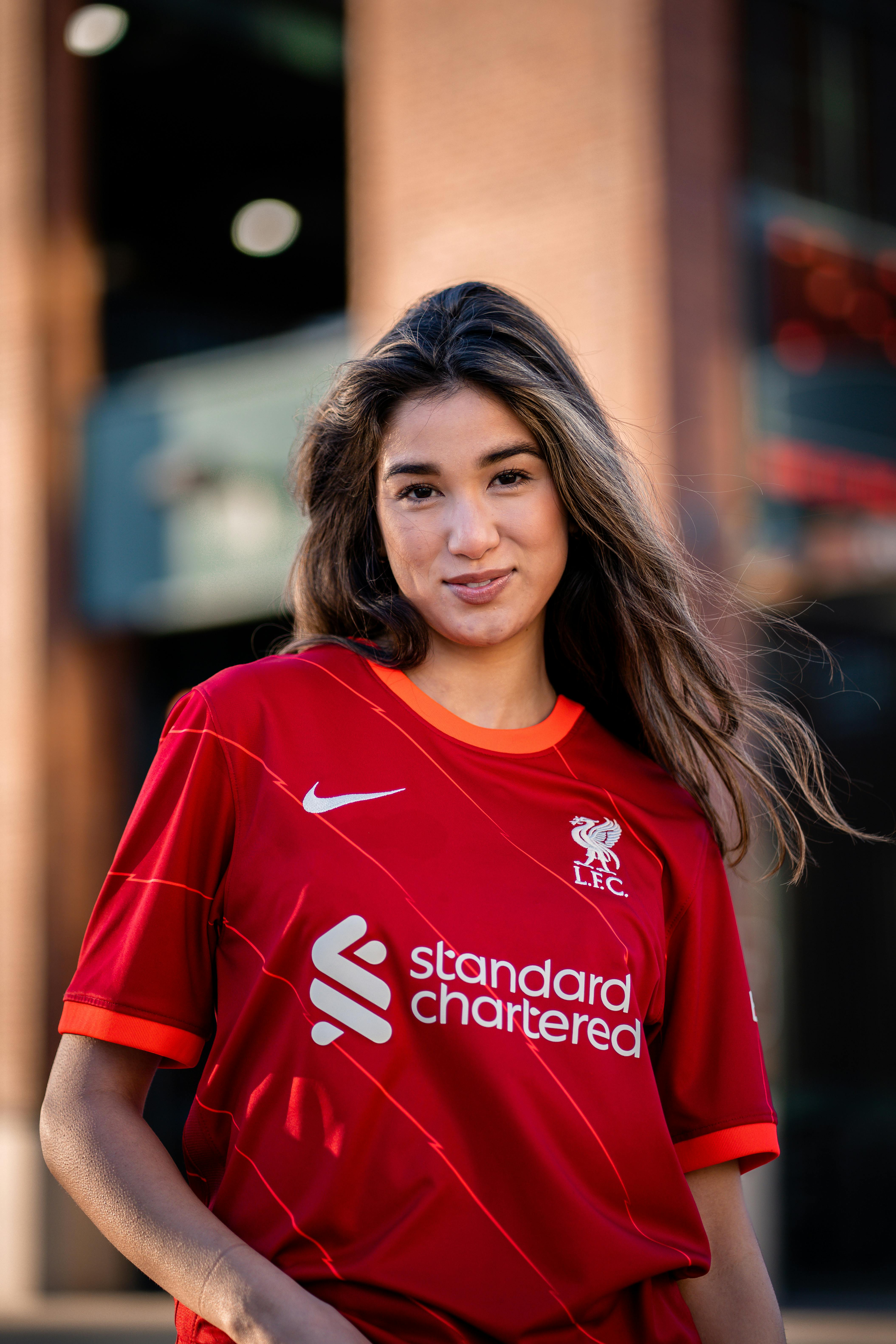 young woman in a football liverpool fc t shirt