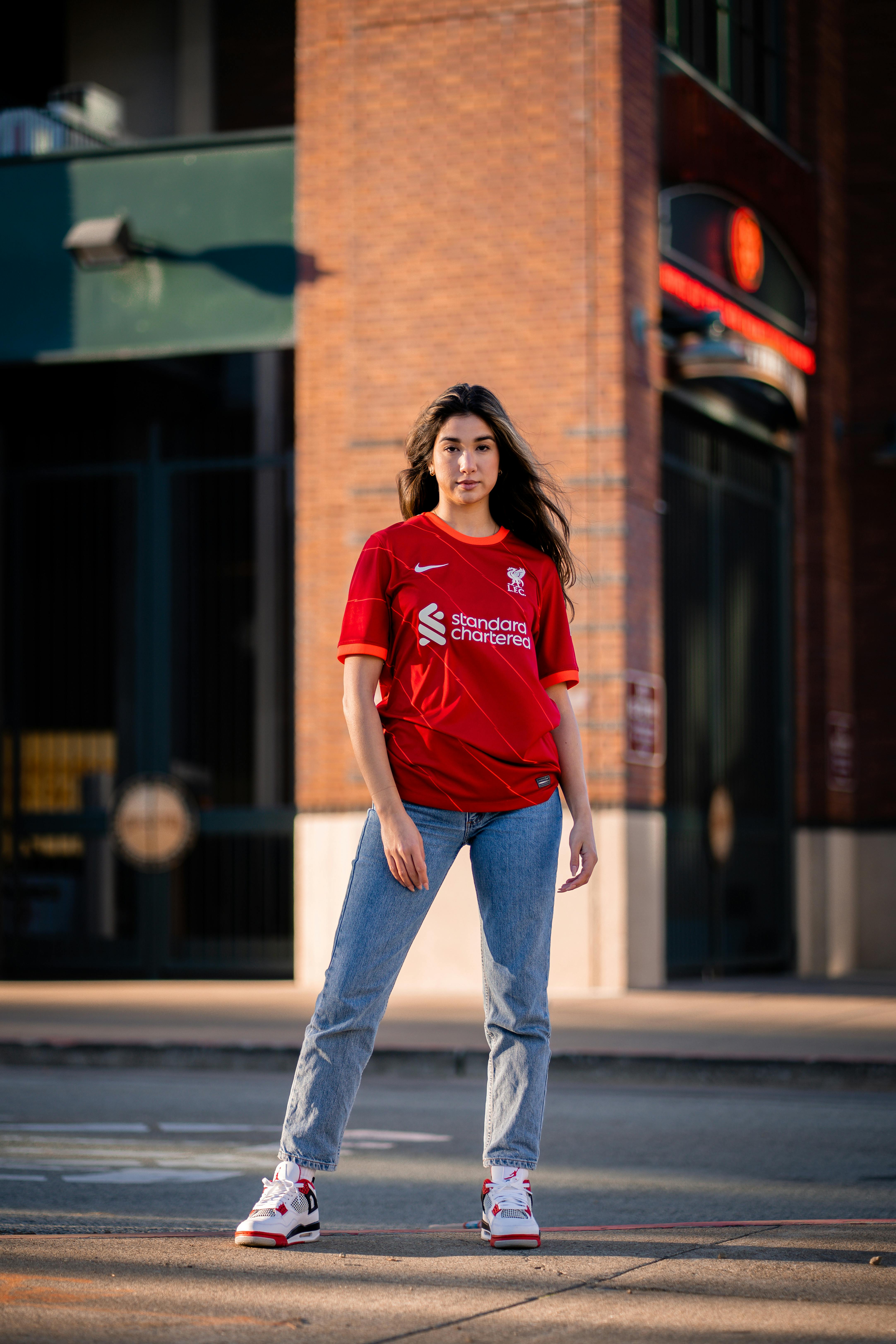 Young Woman in a Football Liverpool FC T-shirt · Free Stock Photo