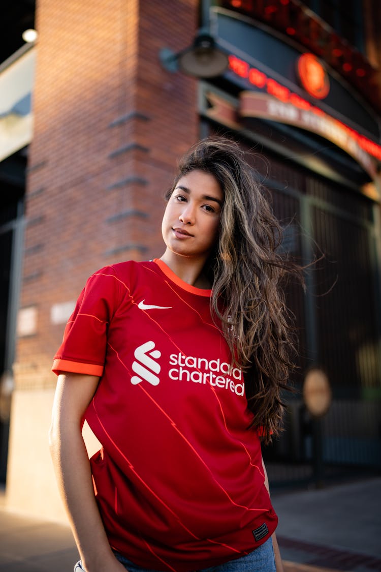 Young Woman In A Football Liverpool FC T-shirt