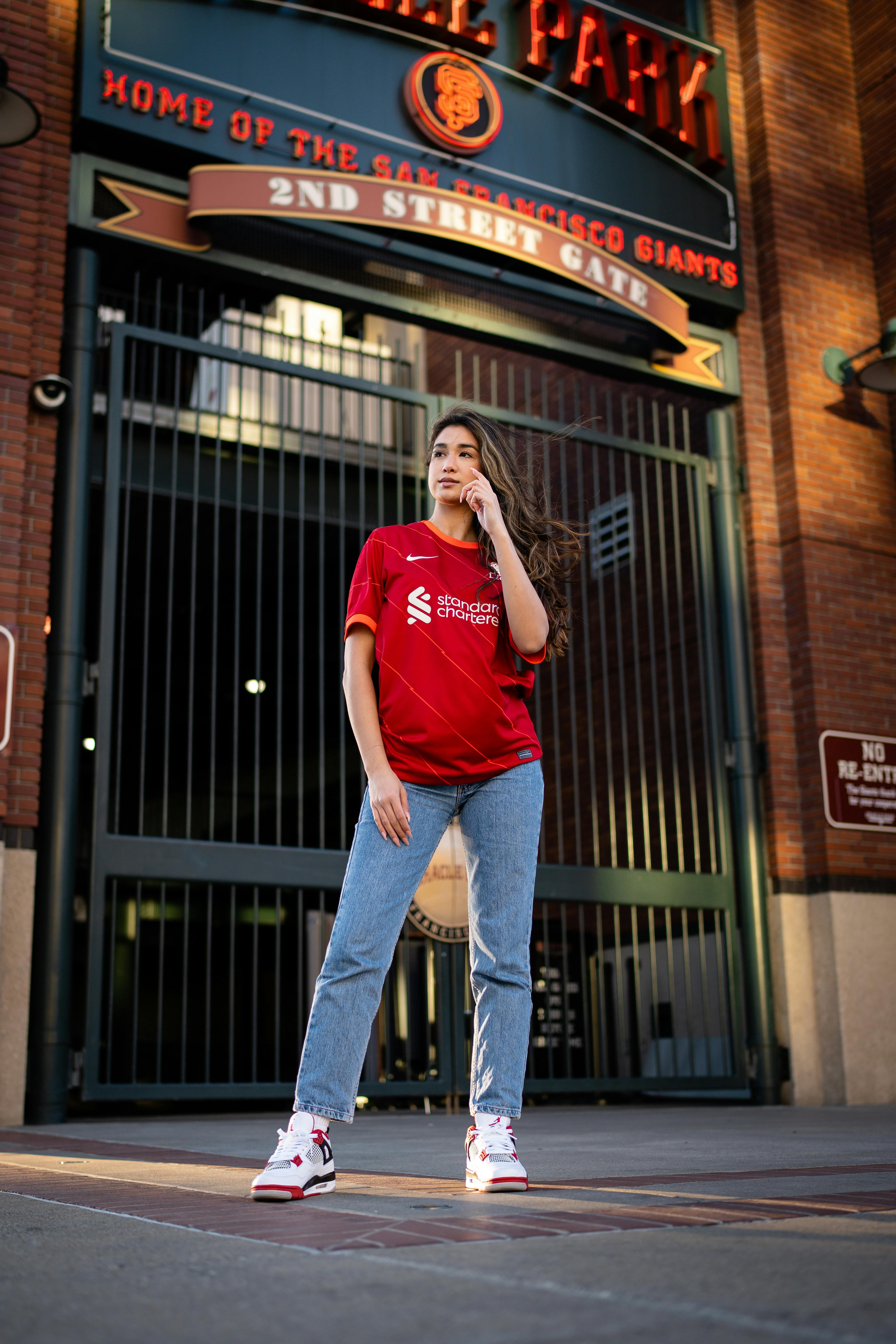 young woman in a football liverpool fc t shirt